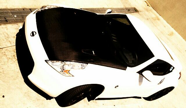 My 370z 
r35 Hood CF installed
Black fangs 
Glossy black OEM sports wheels 
Stillen G3 intakes 
Tein Lowering Springs