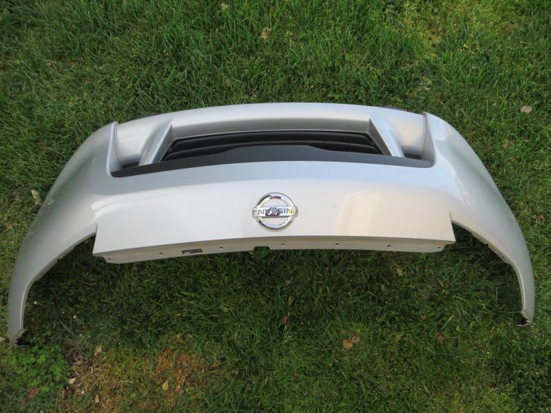 the front bumper in the grass