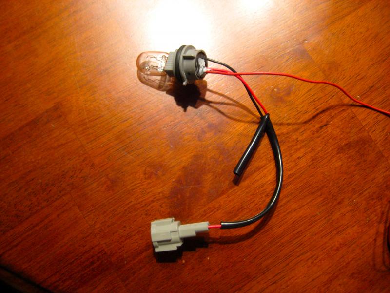 took the original bulb from the japanese fog light and found a double filament bulb just like it, then my electrical friend wired a second wire to the not-as-bright filament to tap into the tail light (the brighter one was tapped into the brake light with a flashing modulator in the line from the tap to the fourth brake light)... link to the fog light: http://www.thezstore.com/page/TZS/PROD/370z04/33-1361  (now they sell the whole kit:  http://www.thezstore.com/page/TZS/PROD/370z04/50-3084)