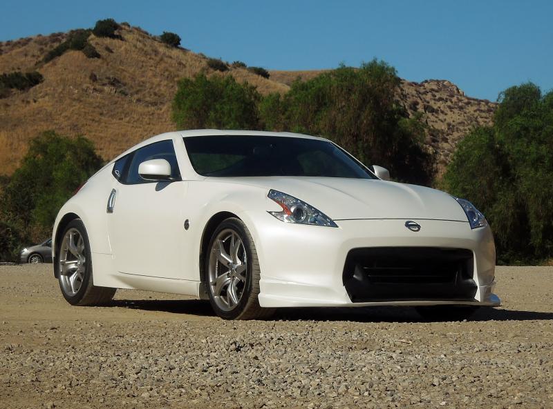 Sept 1, 2012 @ the park.  This is the first lip.  No skirts, no wing, no spats, not lowered, no spacers.  Truly the first mod following the blacked out fangs.