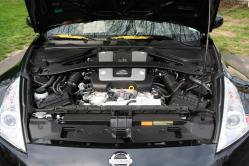 Stock engine bay before I got my hands on it