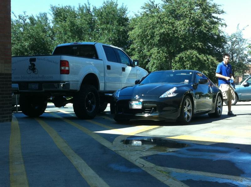 Washing my car next to a huge truck