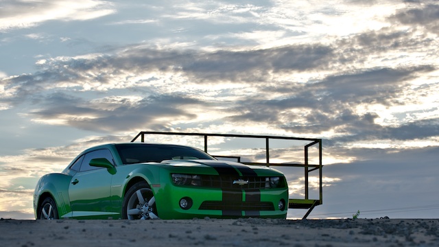 We (me & my chick) took the Camaro out for photos today after having vinyl stripes put on front to back. Looks 10 times better than the stock stripes on the hood and trunk lid IMO. Heritage grille and powder coated rims next