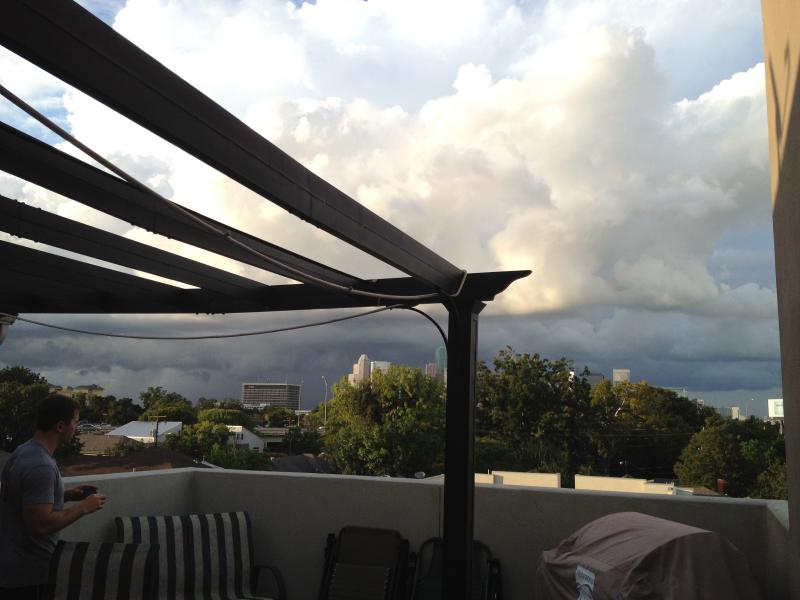 Watching a storm roll in from the roof top deck at the house