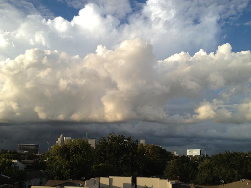 Watching a storm roll in from the roof top deck at the house