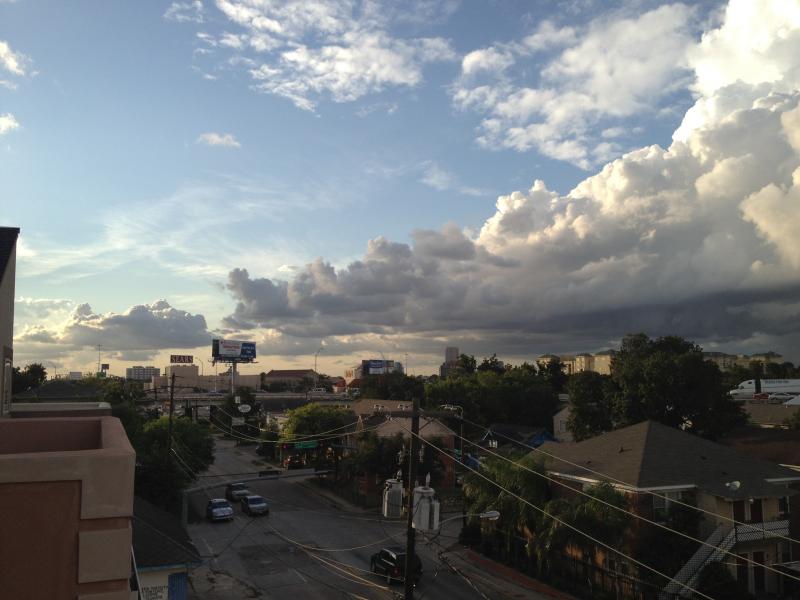 Watching a storm roll in from the roof top deck at the house