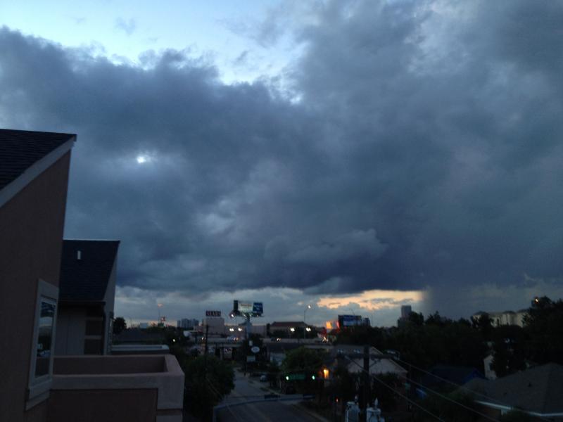 Watching a storm roll in from the roof top deck at the house