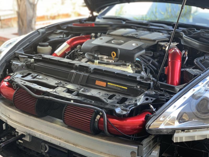 First mod on the Z are these admintuning 3 cold air intakes powder coated red to match the factory akebono breaks