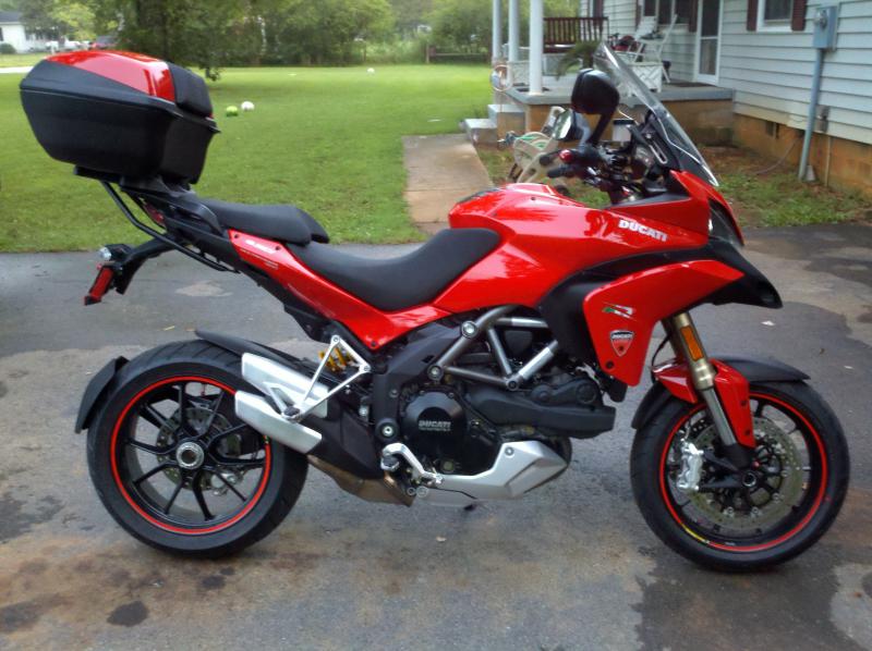 My Multistrada 1200cc and it's new luggage, back when it had the stock exhaust and ecu, different animal nowadays. Oh and matches my red Z..