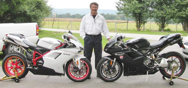 My 2 twins.! That's right.! 848 Stealth Matte Black and the Powder White 848EVO edition. I added the 2 brothers carbon exhaust and duc race ecu to the white one and the black one i added the termignoni carbon exhaust and many carbon panels all over, w/ duc race ecu as well. Both have matching helmets and jackets and cap it off.