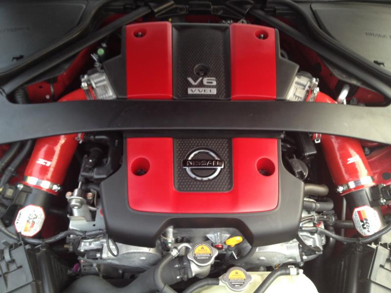 Factory Matched A54 Solid Red Engine Cover & Black Chrome Nissan Badge (Close Up)

Z1 MAF Tubes and K&N Filters Sold 04/08/2016 - Upgraded to AAM Competition S-Line/R-Line Cold Air Intake