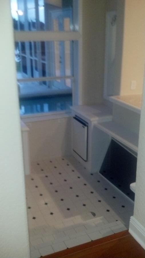 The drop down area that reaches the pool bar, with its own sink and fridge.