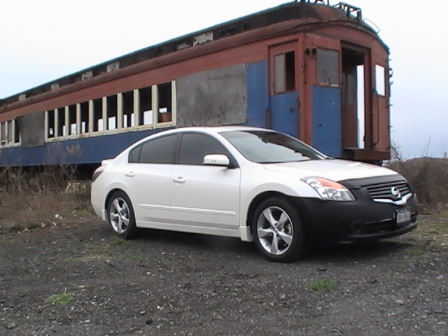 My Altima up state by some old trains.