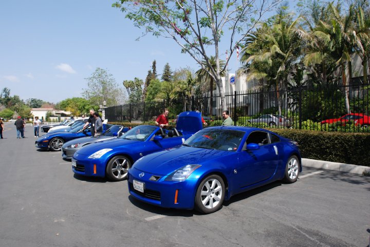 Members showing off their rides at the NHRA parking lot.