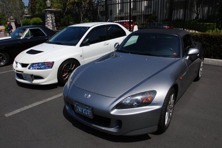 Members showing off their rides at the NHRA parking lot.