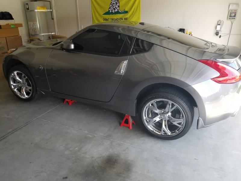 New Chromed Wheels being installed.  LA Wheel and Tire did an amazing job of chroming them!