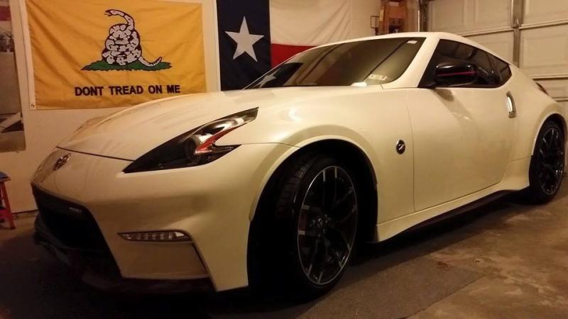 Raining cats and dogs the day after we got her, but here she sits, safe and sound in the garage
2015 NISMO Tech 370Z