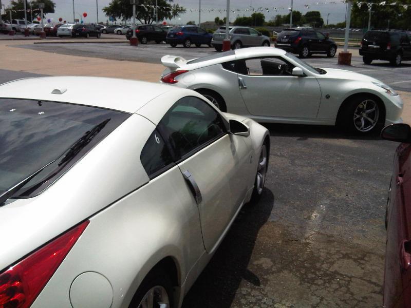 old and new at the car lot