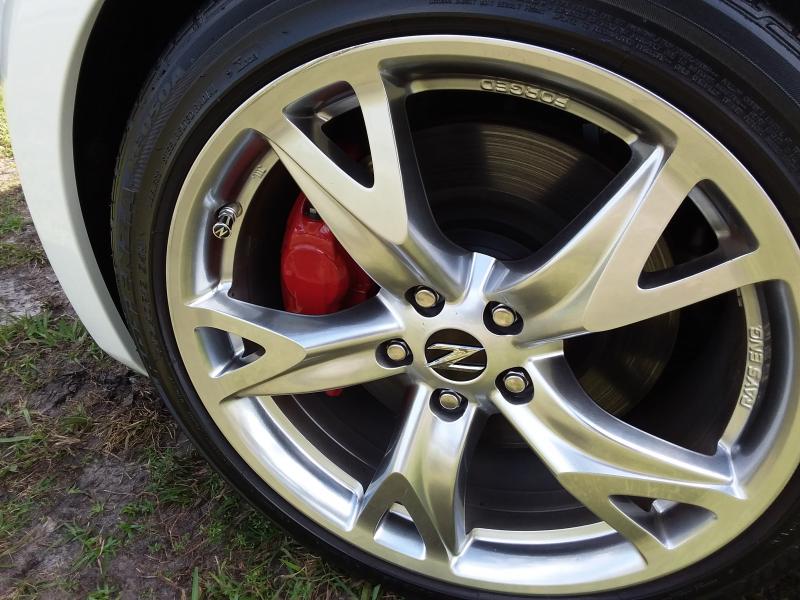 Painted Calipers red and swapped out the hamburger center wheel caps for some custom Z's I made.